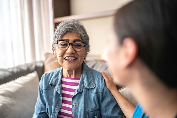 A senior woman meets with a speech therapist at The Guest House Skilled Nursing & Rehabilitation facility in Shreveport, LA